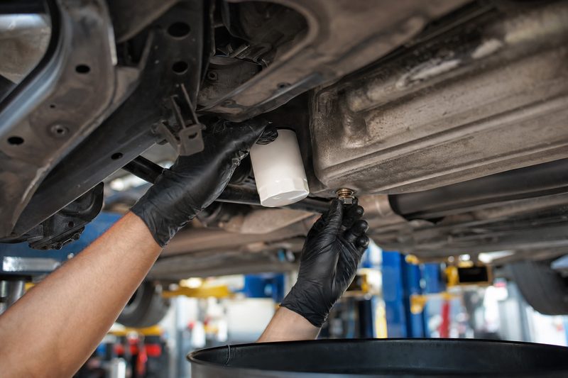 Draining engine oil during an oil and filter change