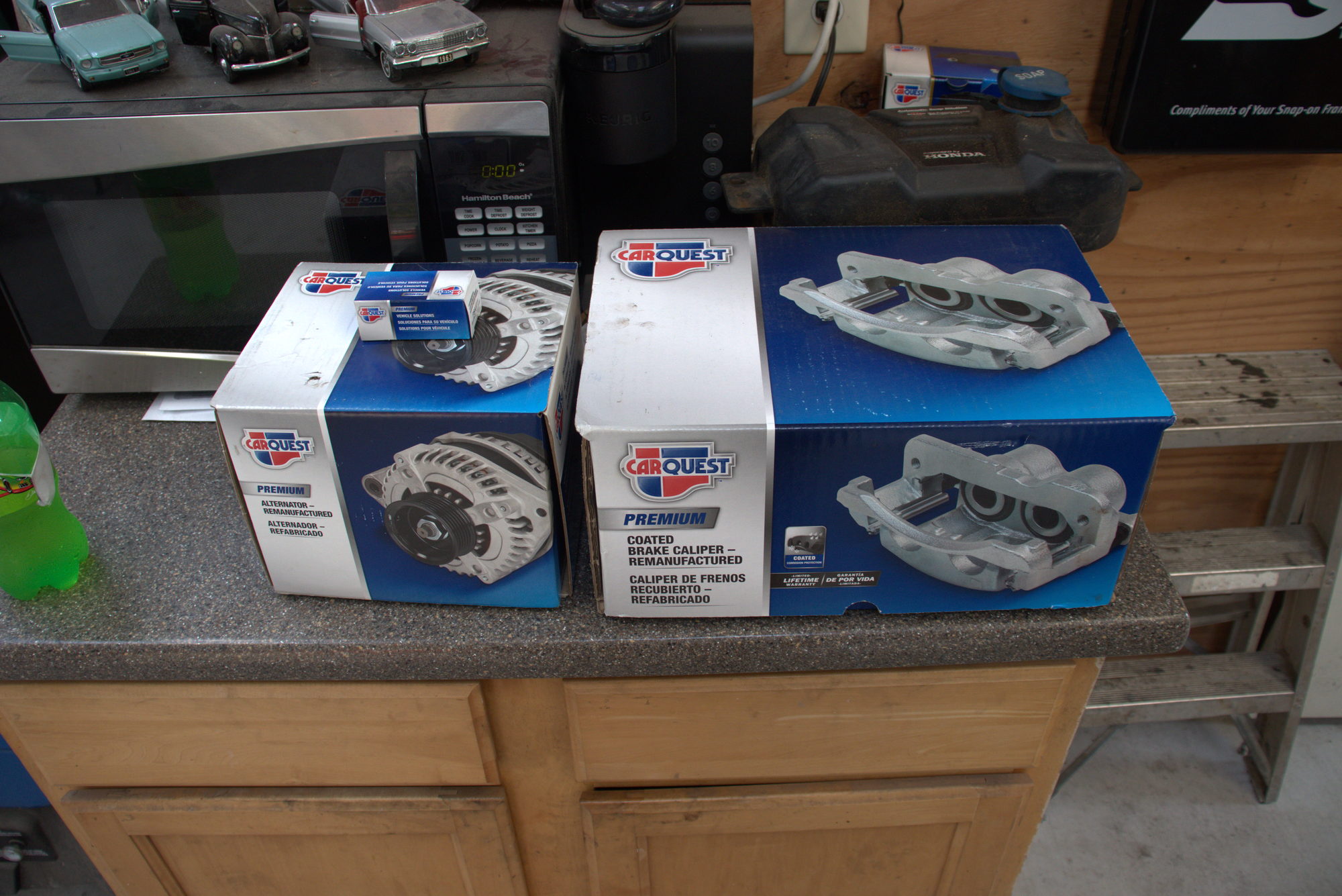 Replacement alternator and brake caliper on the parts counter