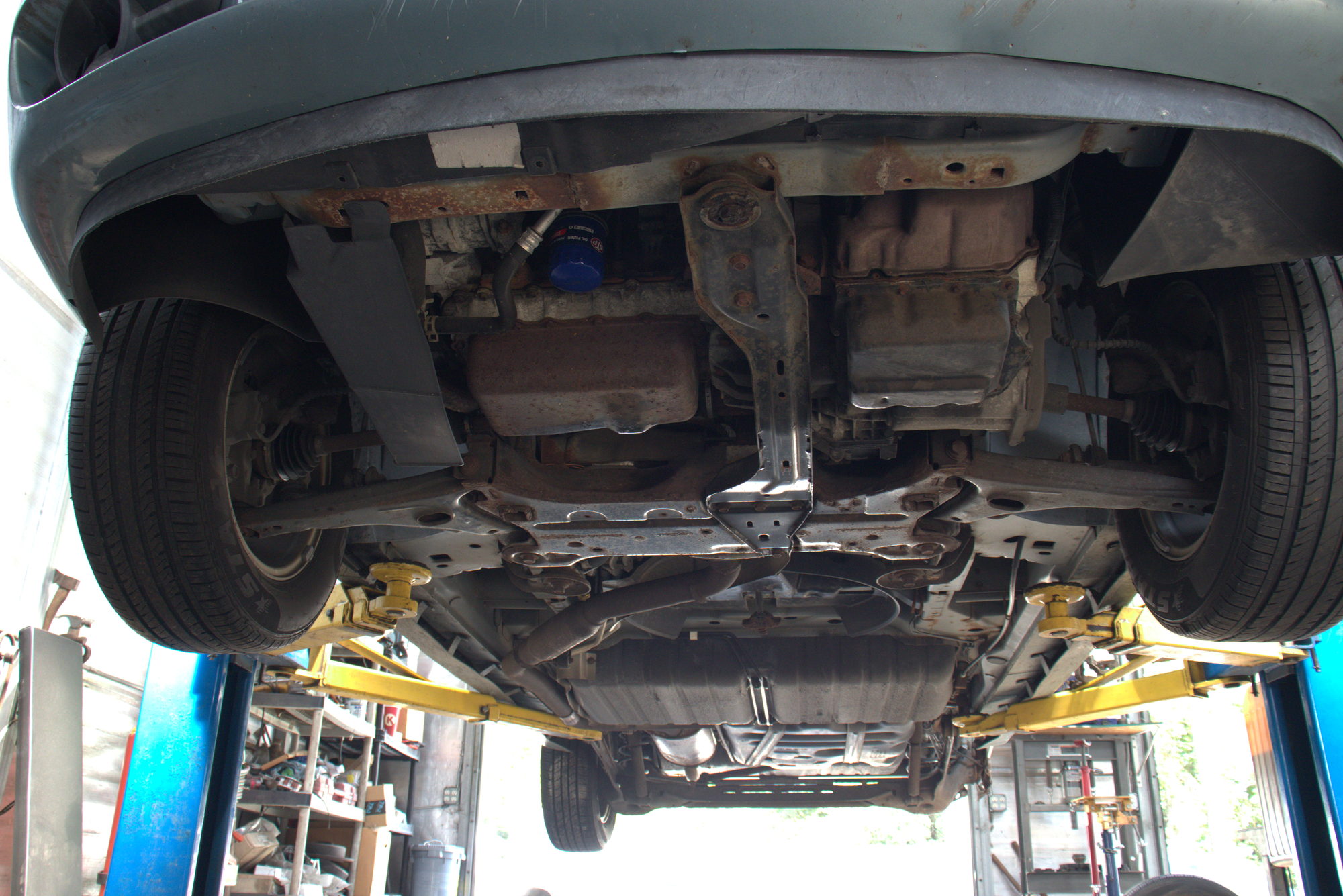 Vehicle up on the lift with the underbody exposed