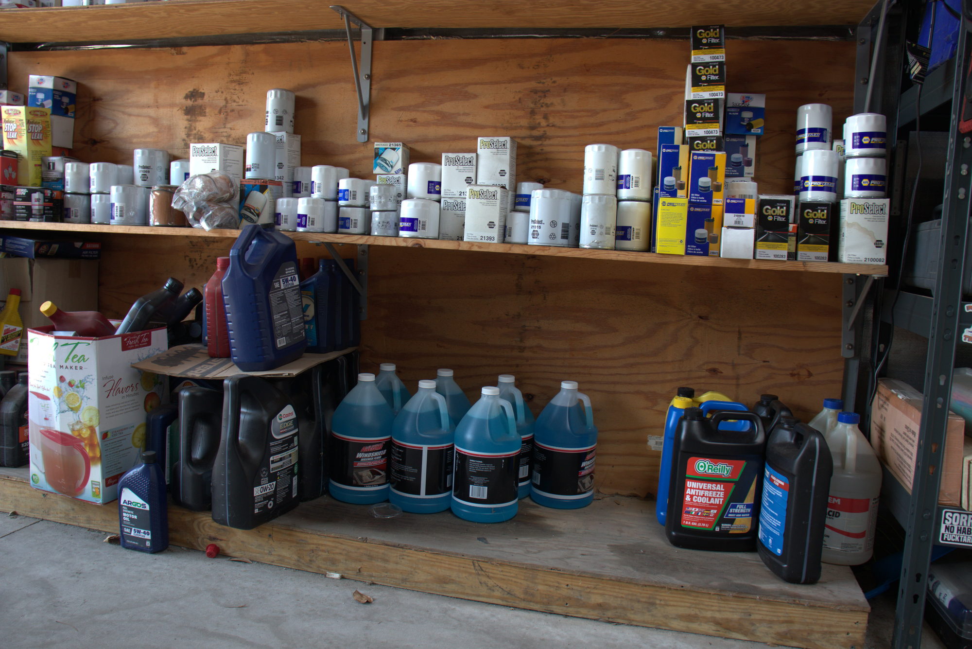 Shelf of motor oil and fluids used for routine services