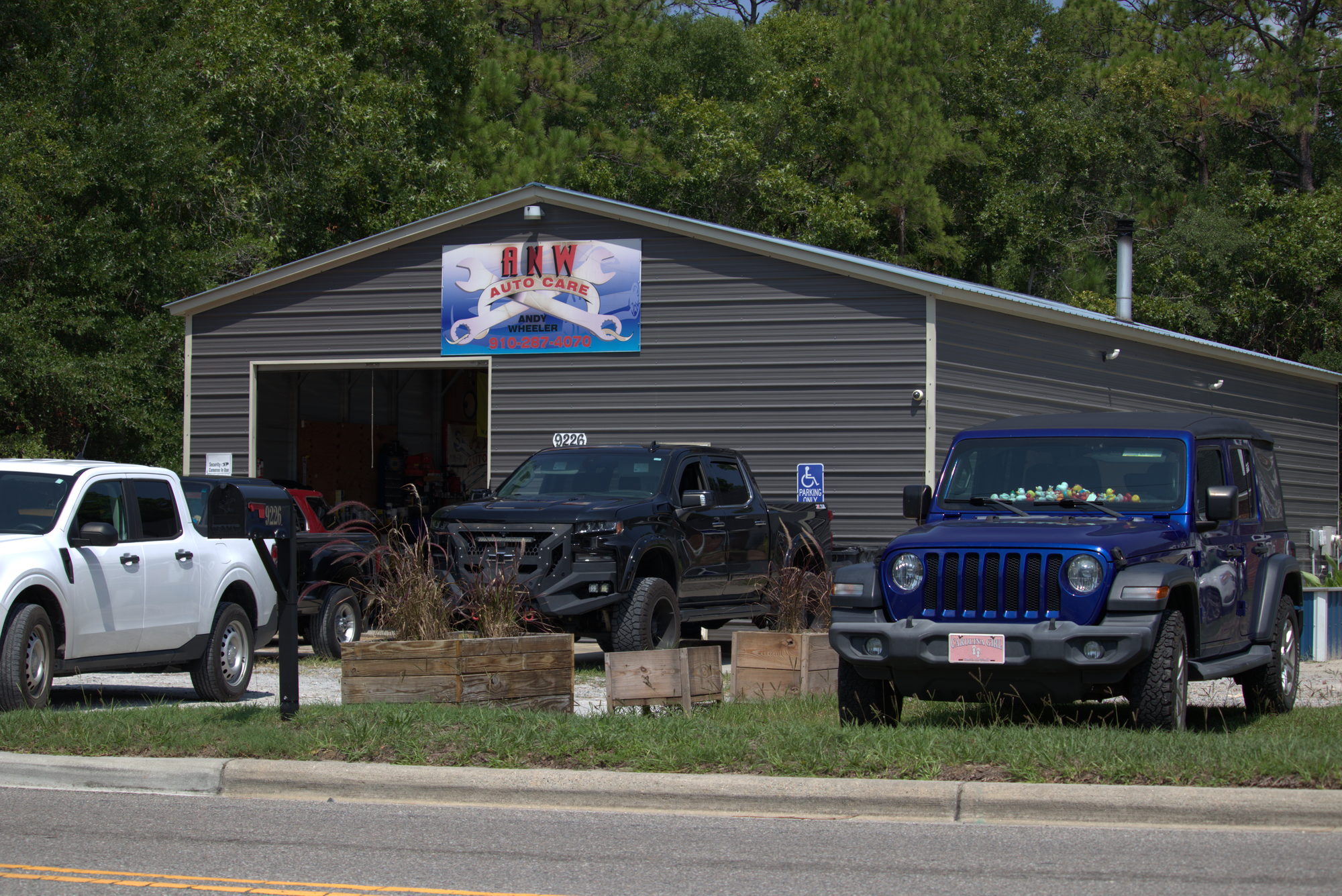 ANW Auto Care shop in Calabash, NC with customer vehicles parked out front