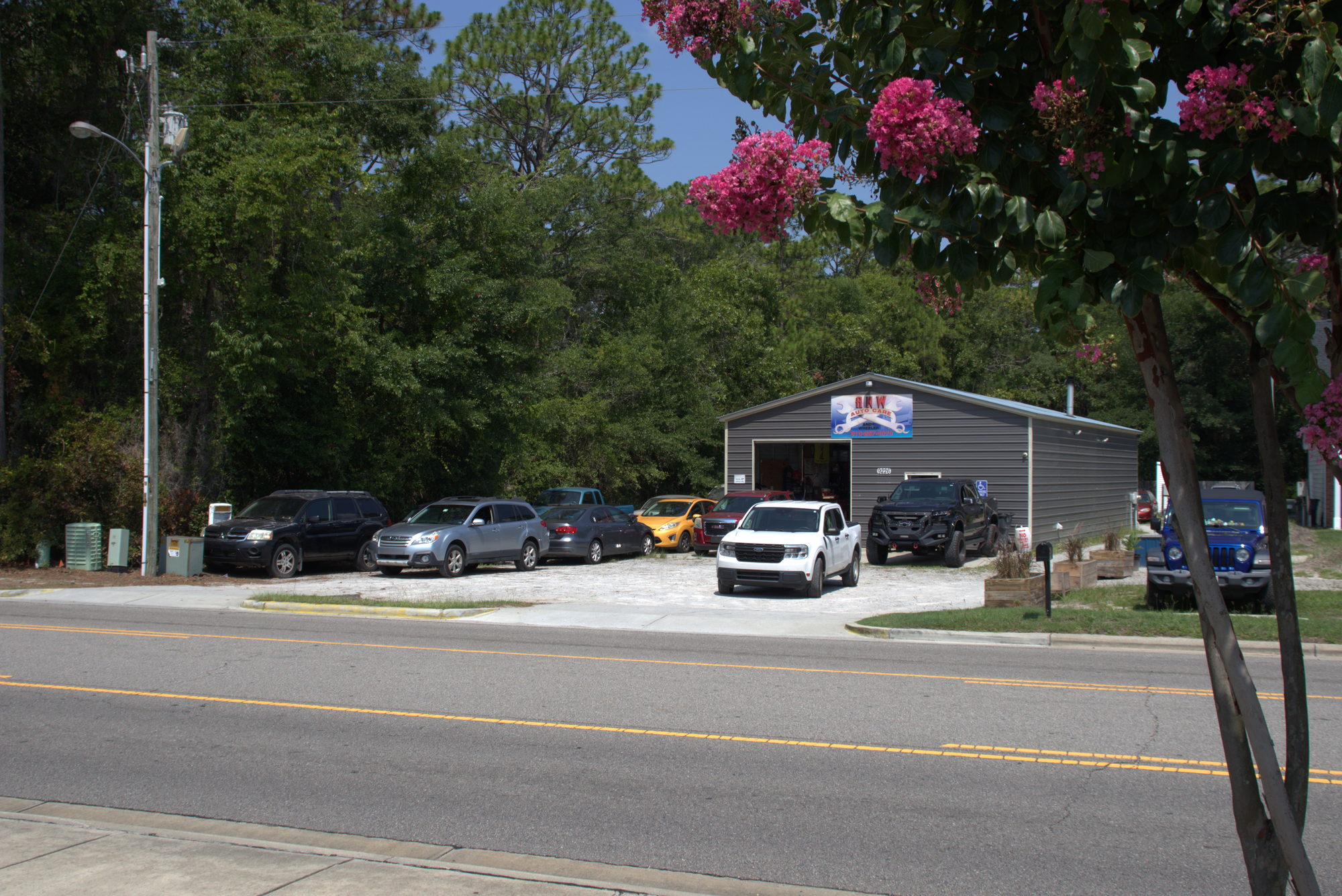 Street-side view of the ANW Auto Care building at the Old Georgetown Centre plaza